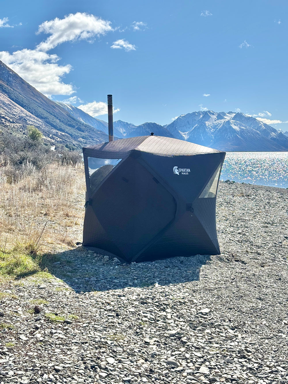 Sauna by lake and mountains