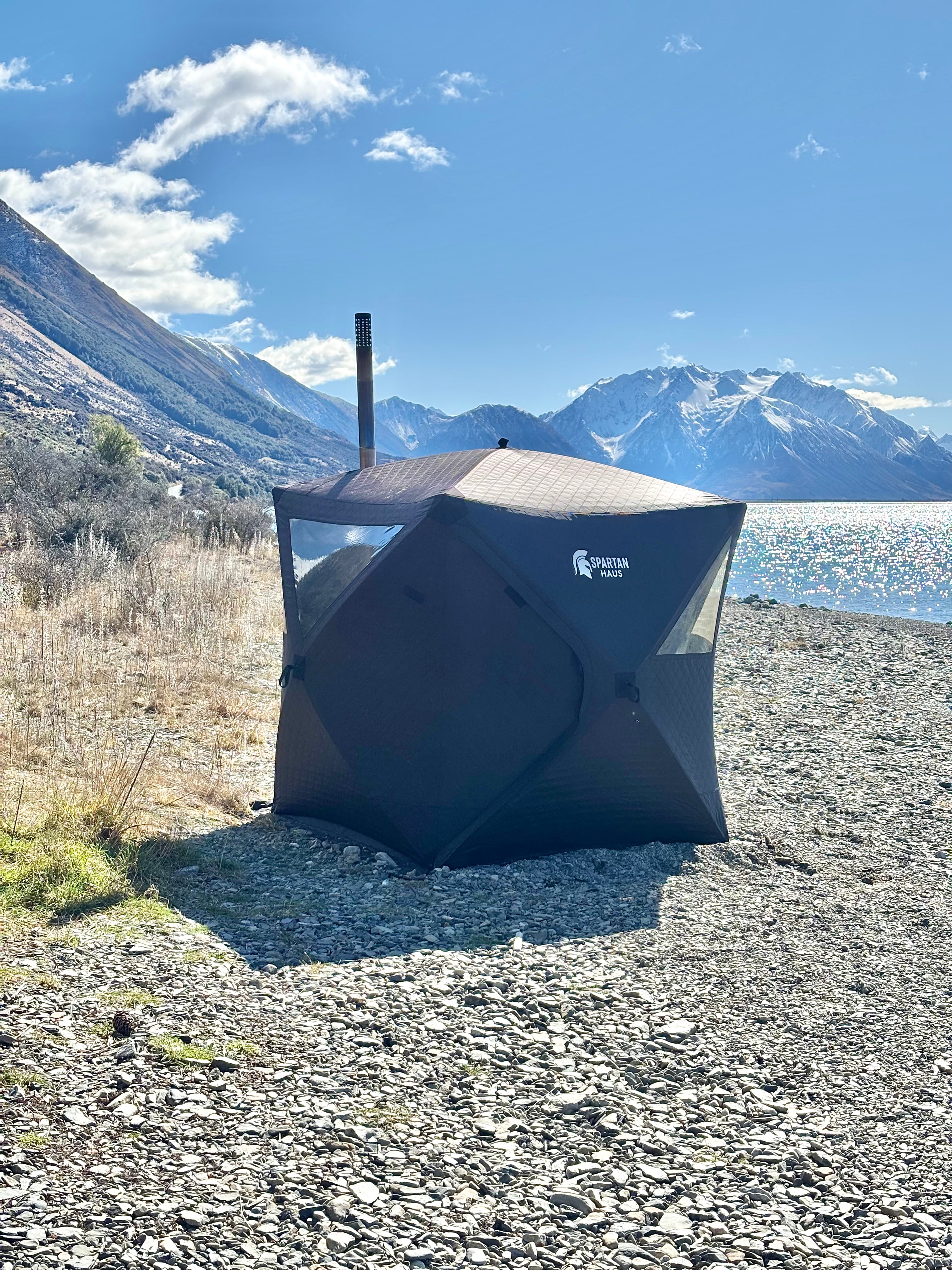 Sauna by lake and mountains